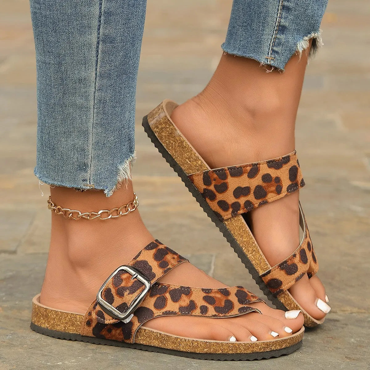 Leopard print Roman style slippers with a round toe and wooden sole.