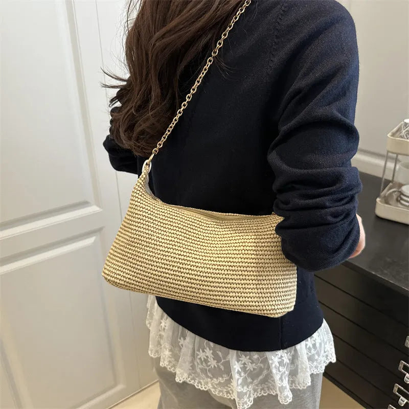 Shoulder tote bag in woven straw material with polyester lining, horizontal square shape, and a medium soft structure, featuring a sandwich pocket and internal mobile phone bag, designed for casual beach and street use in black, white, or khaki