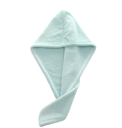 Pink microfiber hair drying towel measuring 25x65cm with button fastening shown wrapped around hair