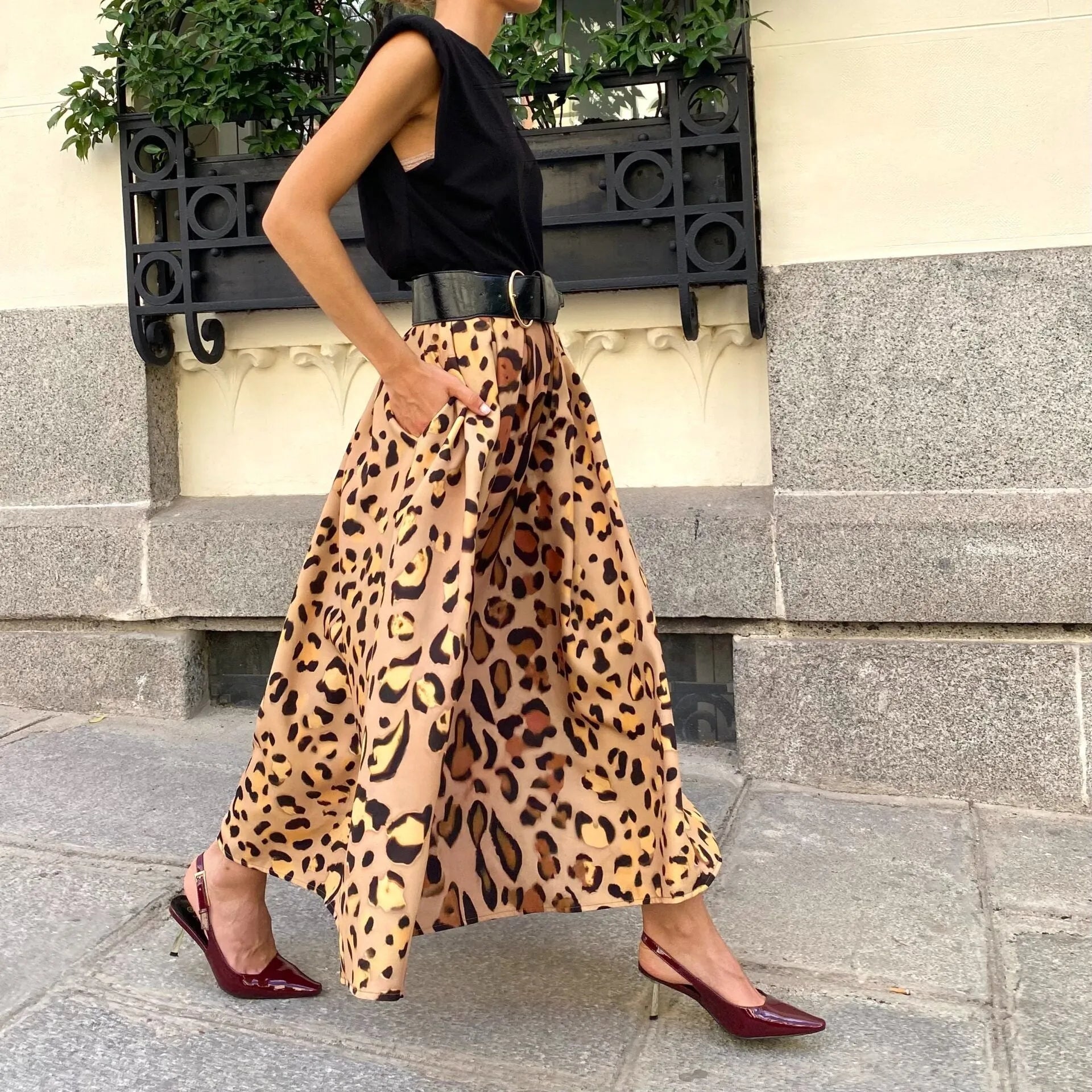 Brown leopard print A-line long skirt with 120cm hem, made from 100% polyester fabric, shown in sizes S to XL.