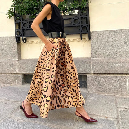 Brown leopard print A-line long skirt with 120cm hem, made from 100% polyester fabric, shown in sizes S to XL.