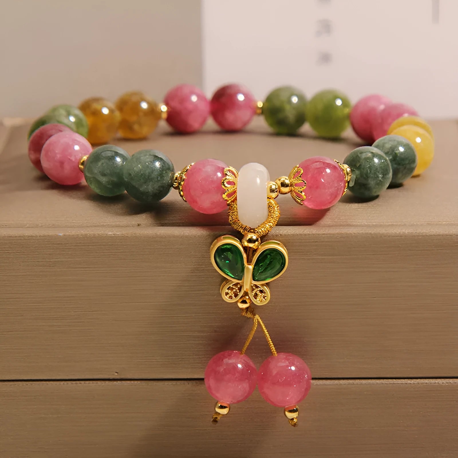 Women's tourmaline butterfly pendant bracelet with colourful stone details and rhinestone elements