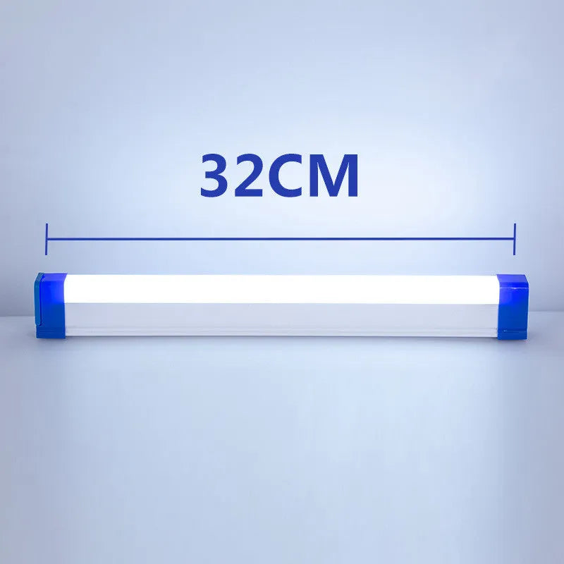 Blue rechargeable LED light tube with USB plug and push-button switch on a dark surface
