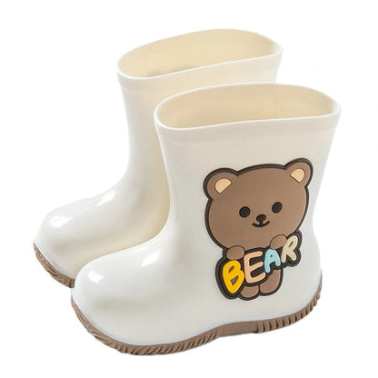 Children's PVC rain shoes with cartoon bear design showing waterproof construction and low heel