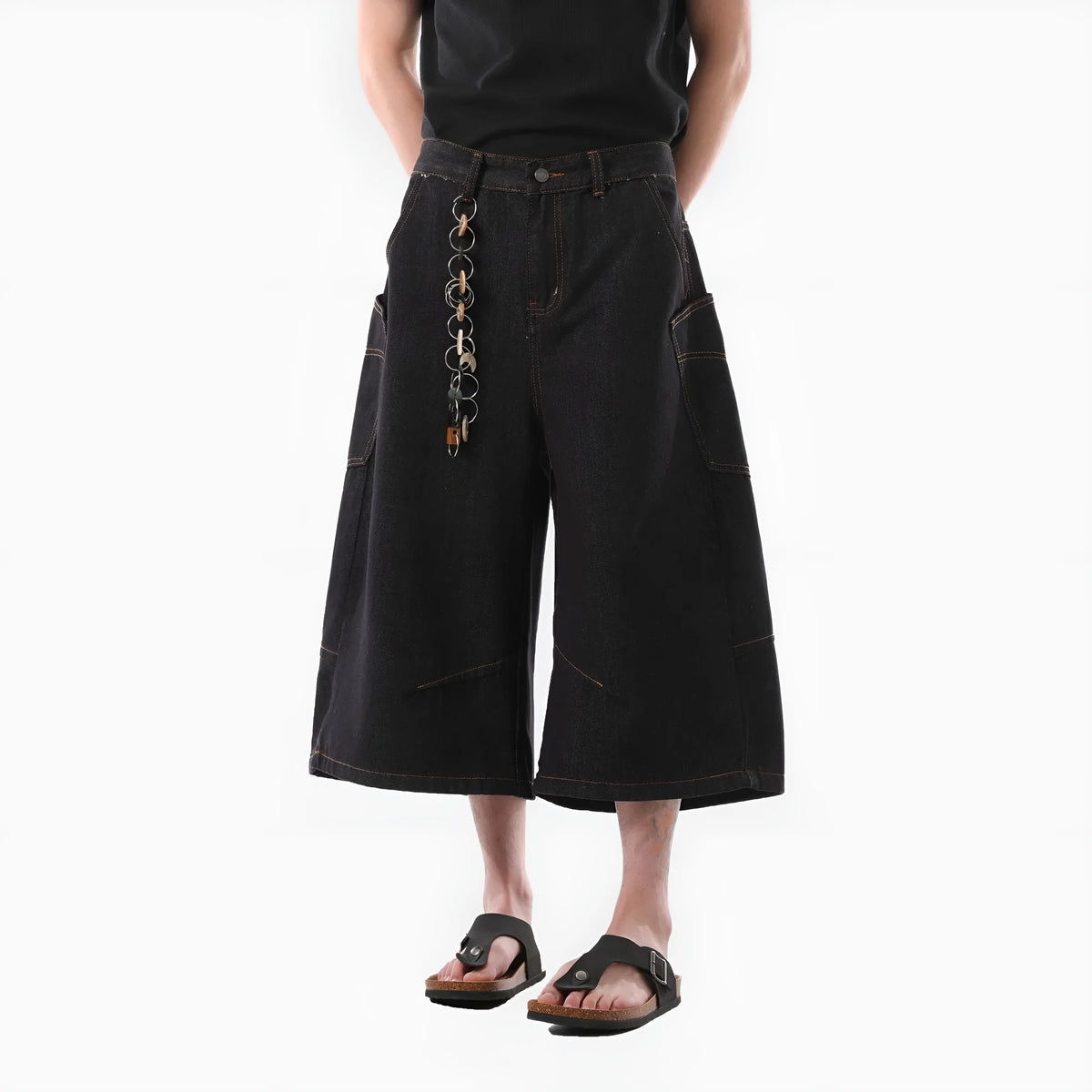 Men's black retro washed denim cropped pants with straight legs and side pockets laid flat