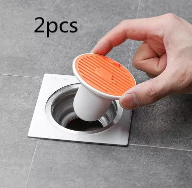 Whale Magnetic Suction Floor Drain Cover in white, orange, or green, blocking sewer odors with a tight seal