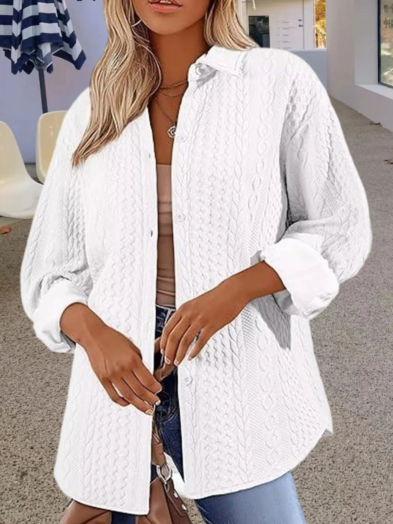 Women's solid colour cardigan sweater in black, shown open as a long-sleeved layer.