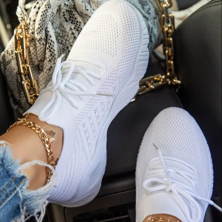 Women's solid colour sneakers with a thick sole, shown in multiple colour options.