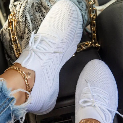 Women's solid colour sneakers with a thick sole, shown in multiple colour options.