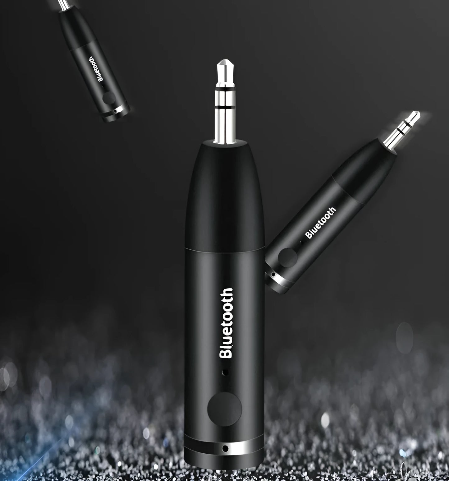 Compact black Bluetooth audio receiver with 3.5mm jack for car stereo and USB cable.
