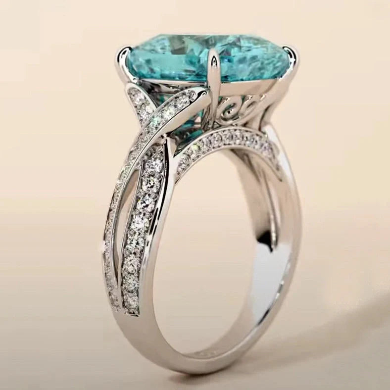 Adjustable women's ring with 4mm square blue zircon stone on silver-tone band