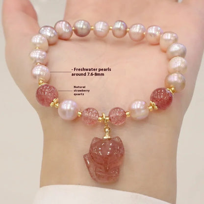 Women's light pink freshwater pearl bracelet with fox charm and zodiac animal design