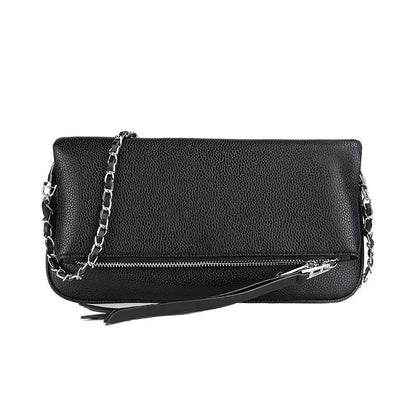Soft black PU leather women's clutch bag with a gold chain strap, shown held and worn cross-body.