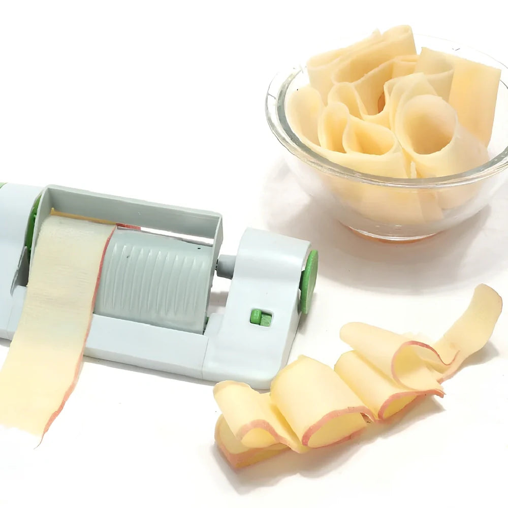 Green and white kitchen fruit slicer with 8mm blades on 22.5cm frame