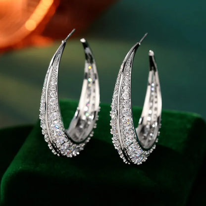 Geometric women's hoop earrings in gold white, purple, green, black, or silver white zirconium plating.
