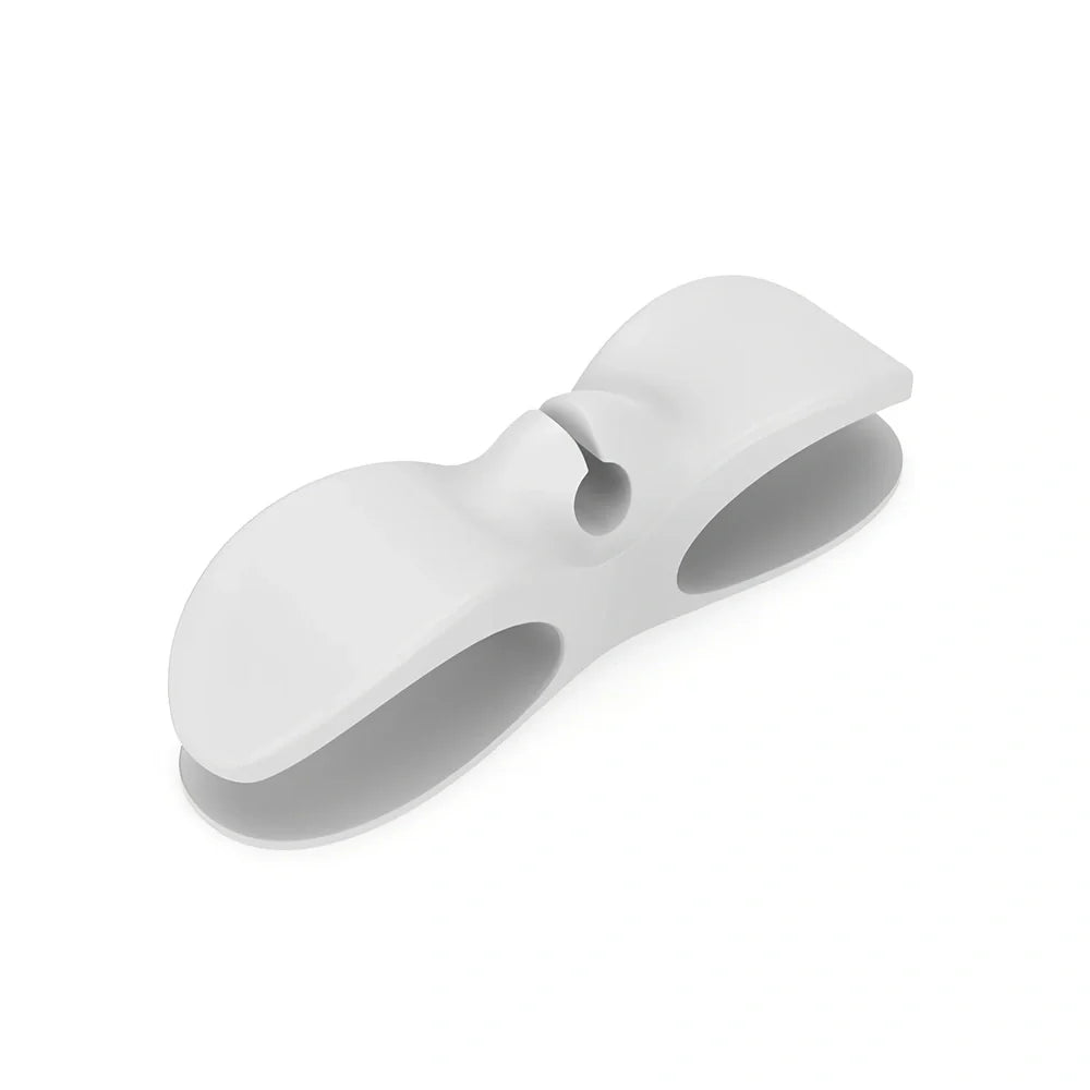 Black TPU cable organizer clips winding appliance cords on kitchen counter, 5cm size, non-marking adhesive for tidy management