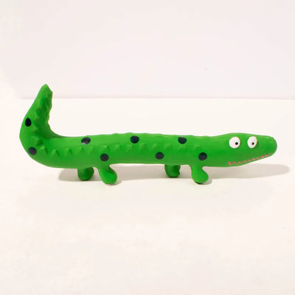 Green lizard-shaped dog chew toy with textured surface and squeaker, measuring 24cm long