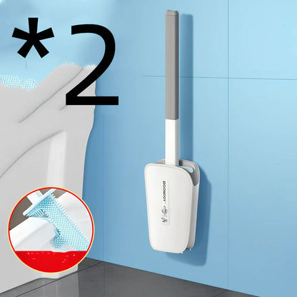 Blue toilet brush with angled TPR bristles in wall-mounted bucket for bathroom cleaning