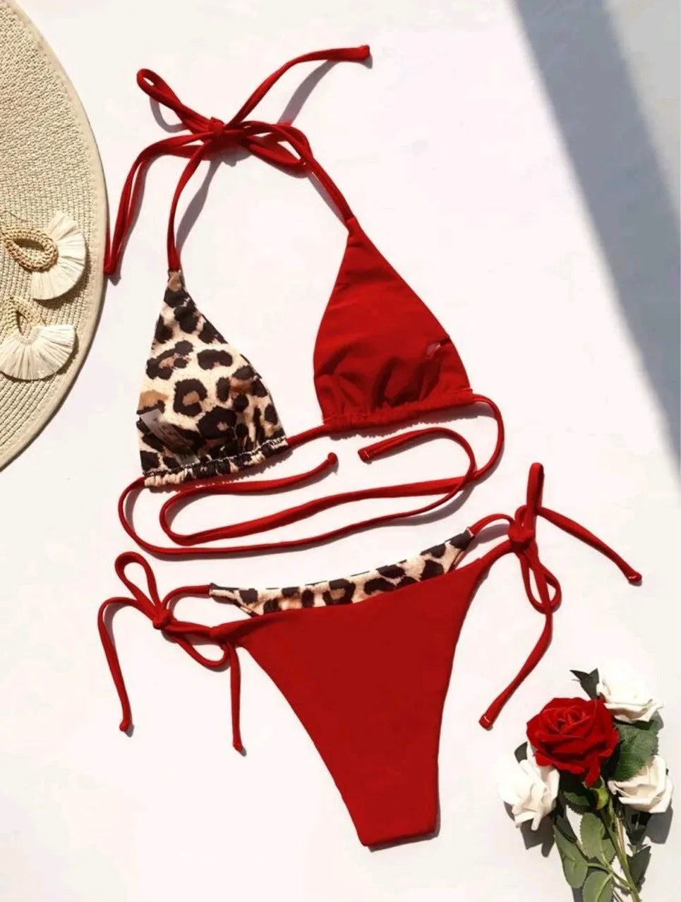 Women's leopard print halter bikini with lace-up ties and split leg swim bottoms
