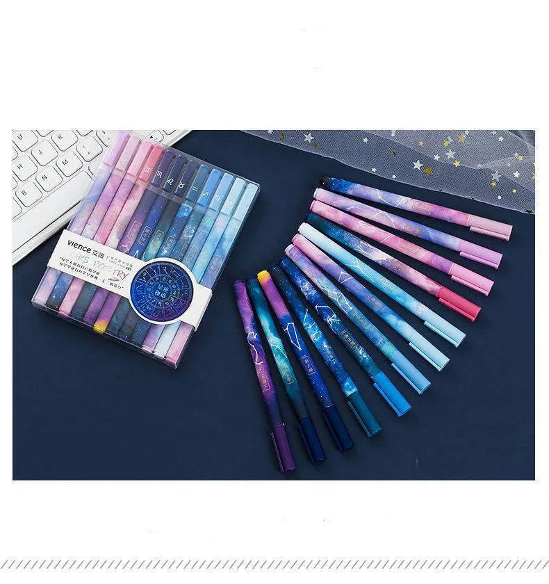 Twelve constellation ballpoint pens in a 12-piece plastic zodiac pen set with bright star designs.