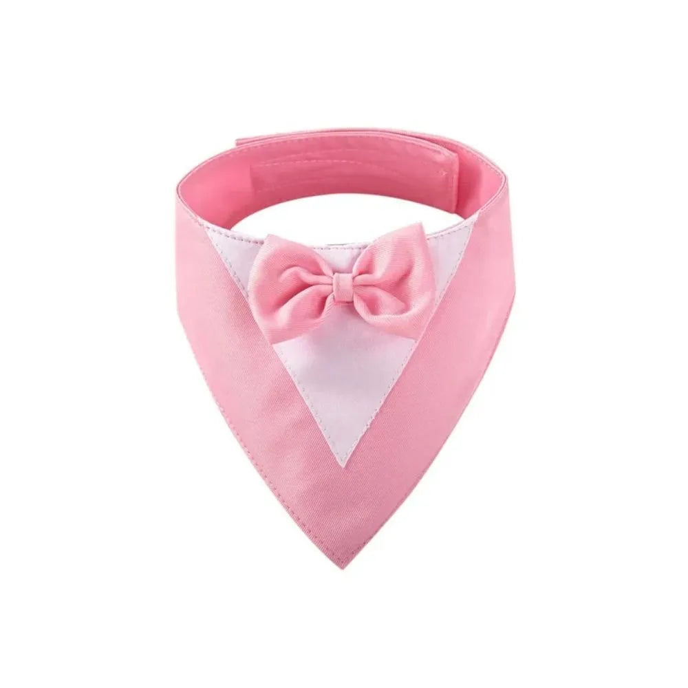 Triangle-shaped pet bib scarf with a bow, shown in a bright colour, displaying the soft fabric and absorbent towelling lining.