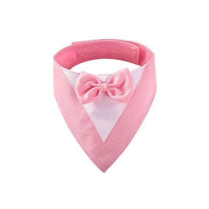 Triangle-shaped pet bib scarf with a bow, shown in a bright colour, displaying the soft fabric and absorbent towelling lining.