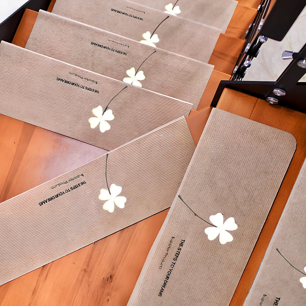 Self-adhesive luminous stair mat with glow strips on wooden staircase, rectangular design with hemmed edges