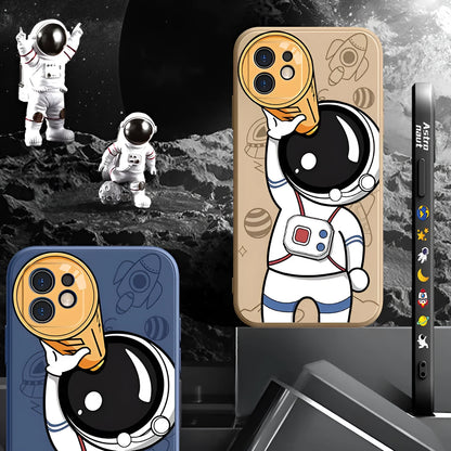 Cartoon astronaut design silicone phone case for iPhone on a black, khaki, or sea blue background.