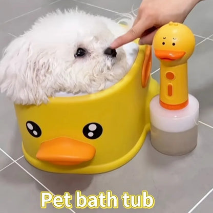 Blue PVC duck-shaped bathtub for washing a small dog or cat outdoors.