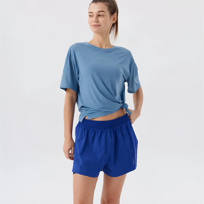 Men's straight-leg sports shorts with side slits in turmeric yellow, night blue, and black colours