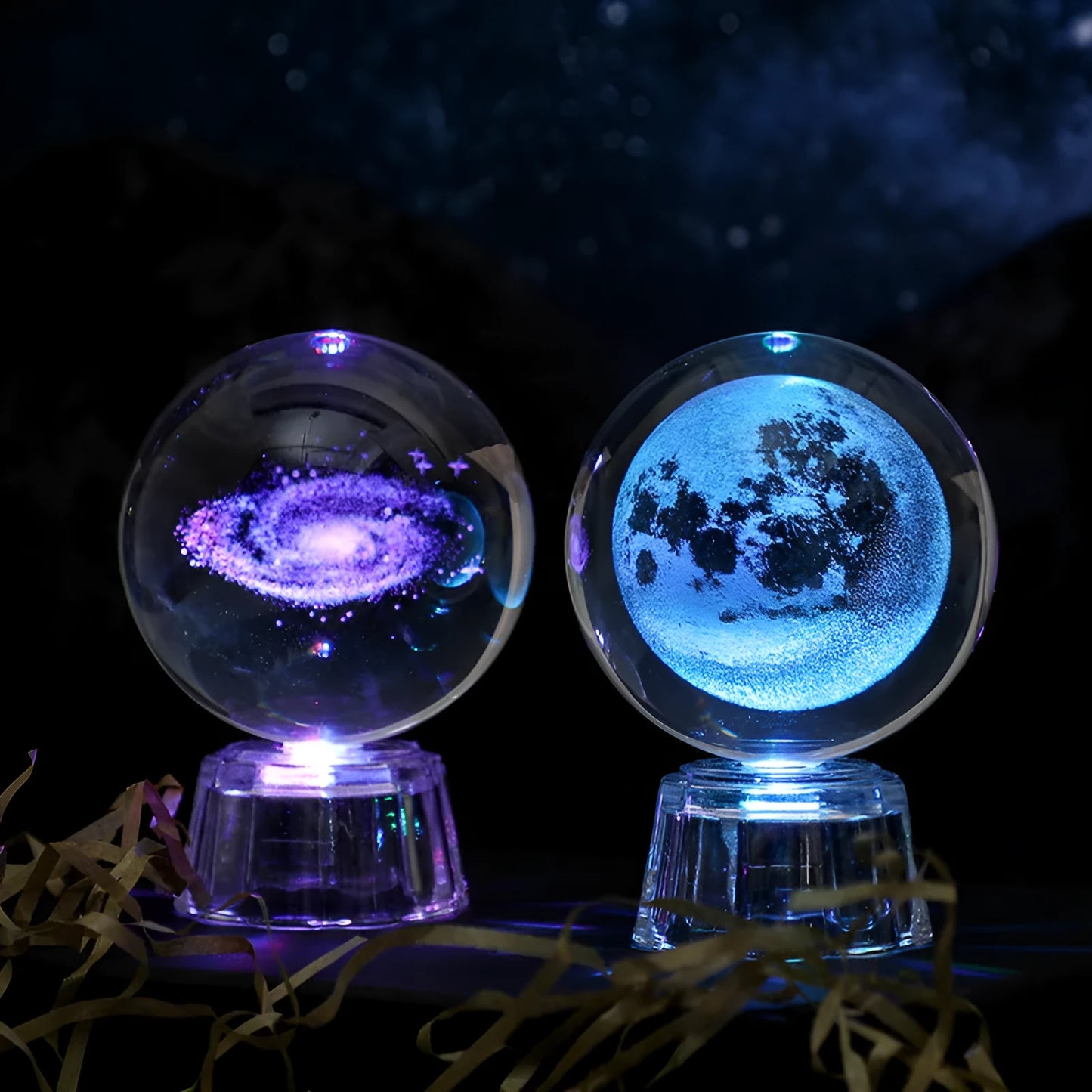 Transparent crystal ball ornament with inner carving of clouds, shown on a wooden table.