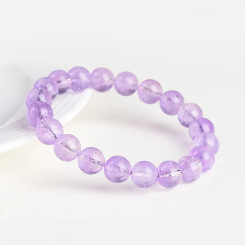 Lavender amethyst bracelet with water ripple geometric beads in various sizes on wrist