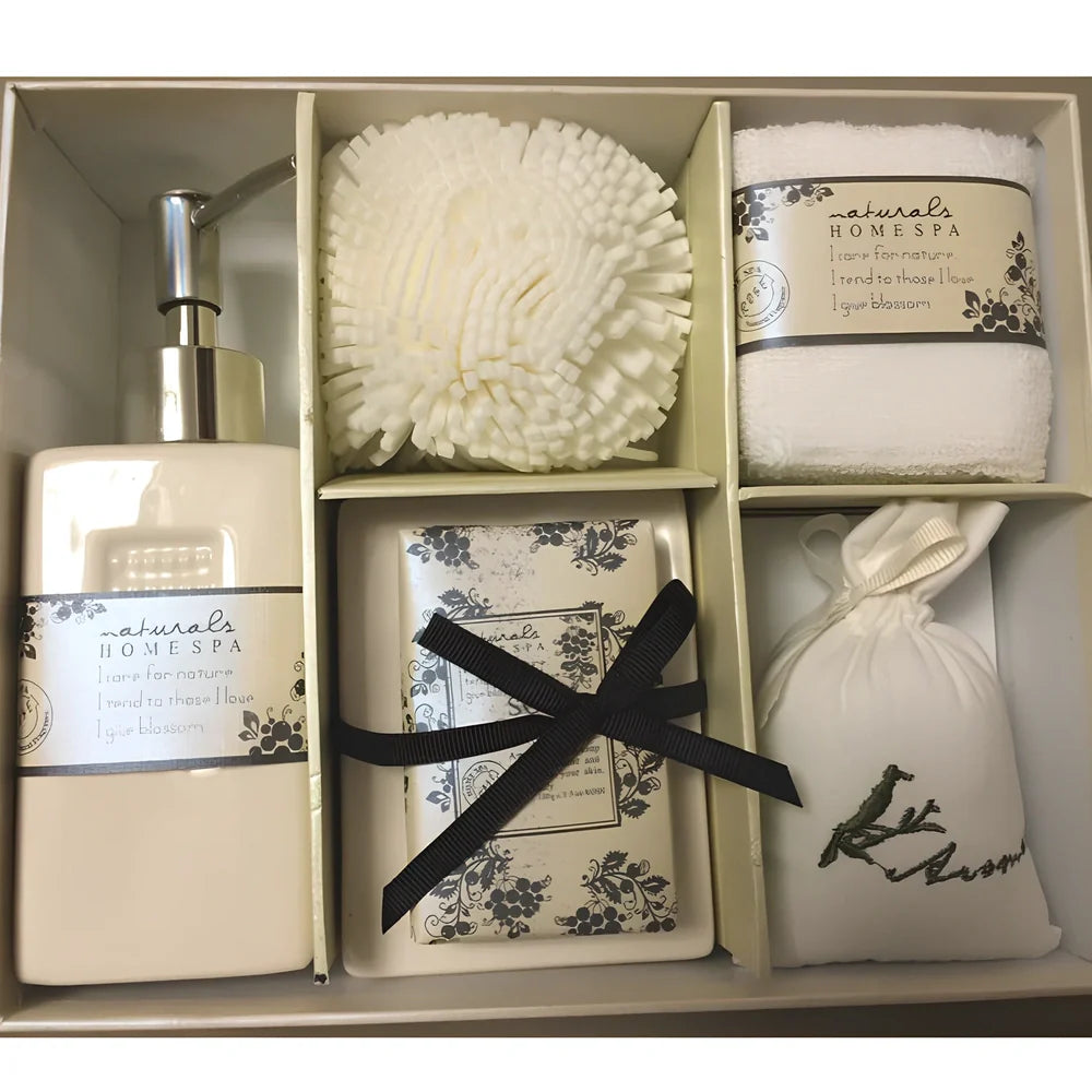 Five-piece ceramic bathroom set with soap dish, toothbrush holder, tumbler, and tissue box cover in coordinated design