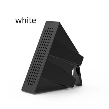 Portable black ABS plastic phone amplifier bracket holding a smartphone on a desk.