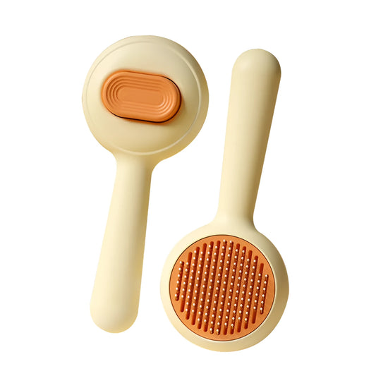 Cat grooming brush with stainless steel teeth and non-slip handle in green or yellow colour options