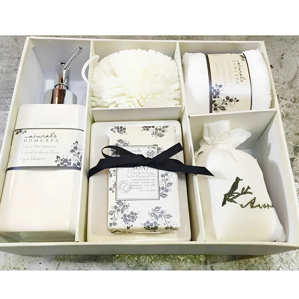 Five-piece ceramic bathroom set with soap dish, toothbrush holder, tumbler, and tissue box cover in coordinated design