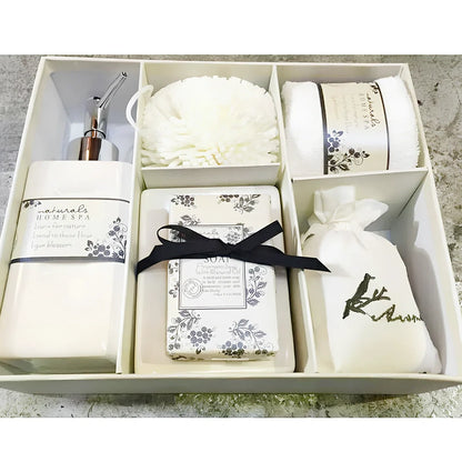 Five-piece ceramic bathroom set with soap dish, toothbrush holder, tumbler, and tissue box cover in coordinated design