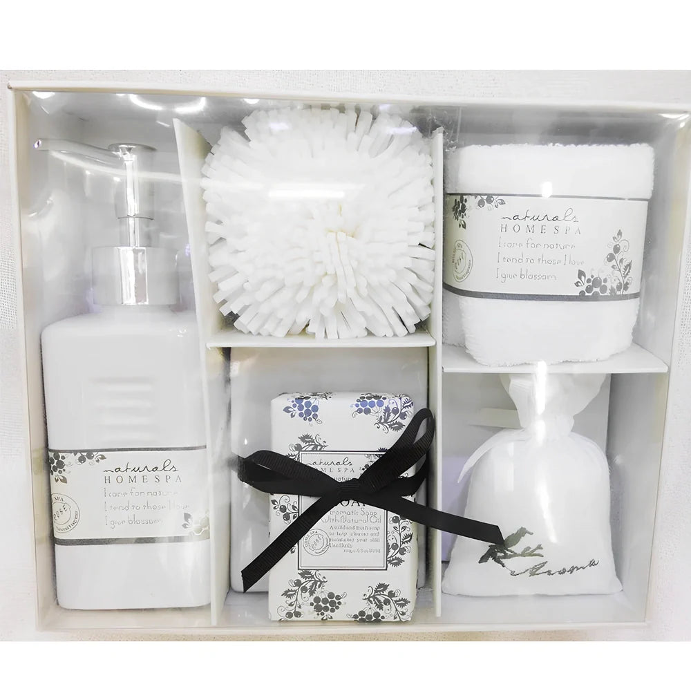 Five-piece ceramic bathroom set with soap dish, toothbrush holder, tumbler, and tissue box cover in coordinated design