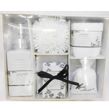 Five-piece ceramic bathroom set with soap dish, toothbrush holder, tumbler, and tissue box cover in coordinated design