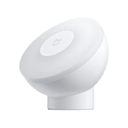 White modern bedside table lamp with human body sensor and Bluetooth connectivity, dimensions 94mm by 94mm by 71mm.