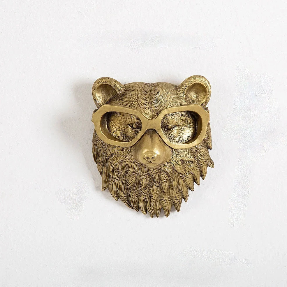 Antique bronze animal pendant showing bear design with synthetic resin construction
