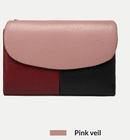 Women's short wallet in soft leather texture with solid colour and stitching detail, urban minimalist style