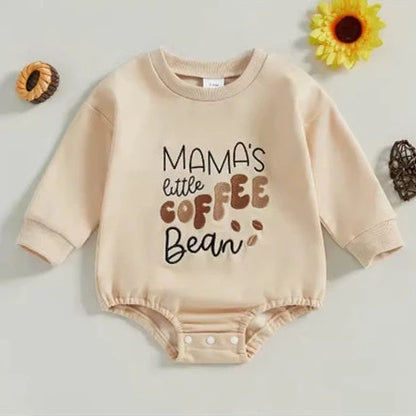 Apricot coloured infant jumpsuit with embroidered alphabet detailing and long sleeves