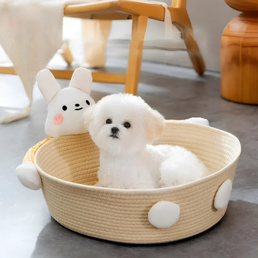 Woven cotton rope basket serving as a pet bed and integrated scratch board for cats, shown in a beige colour.
