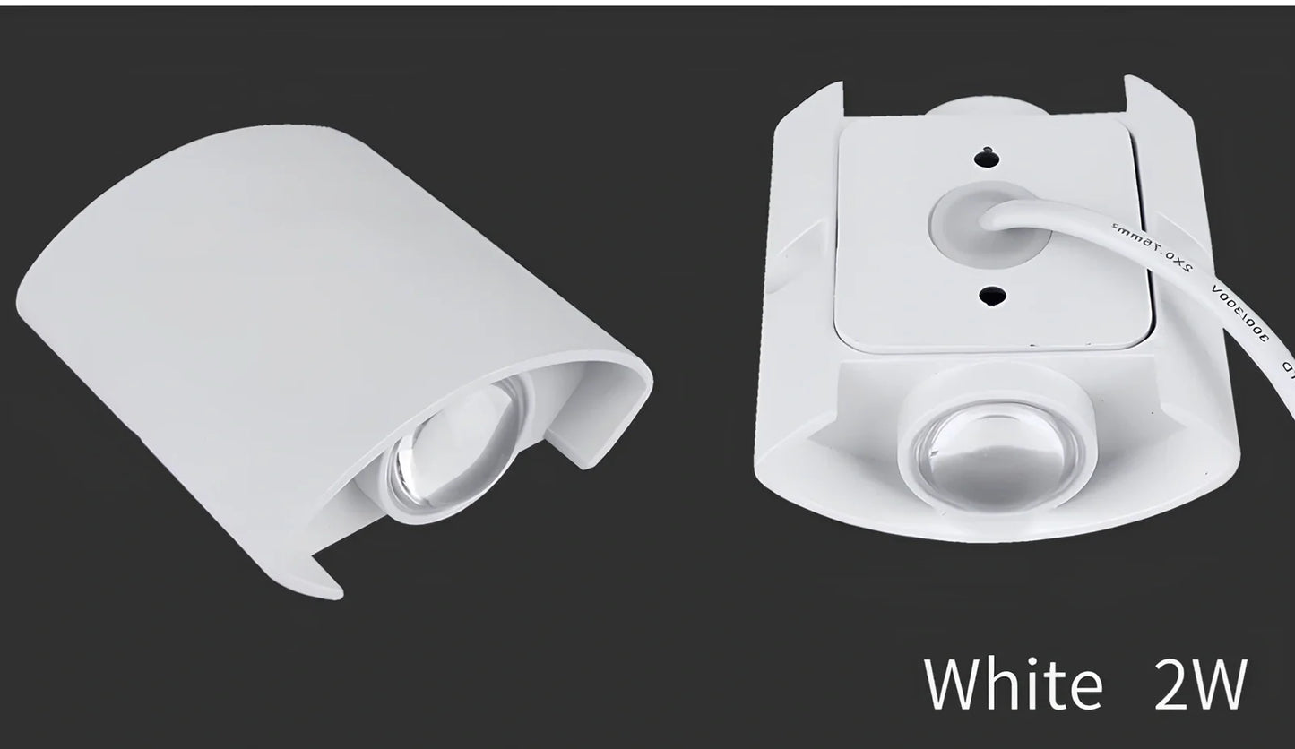 Waterproof black aluminium LED wall lamp 4W warm white emitting 60-degree beam angle mounted on white wall