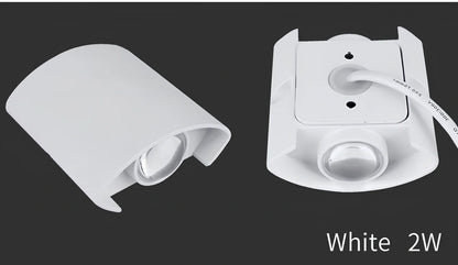 Waterproof black aluminium LED wall lamp 4W warm white emitting 60-degree beam angle mounted on white wall