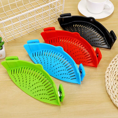 Silicone clip-on kitchen strainer with stainless steel frame attached to pot rim