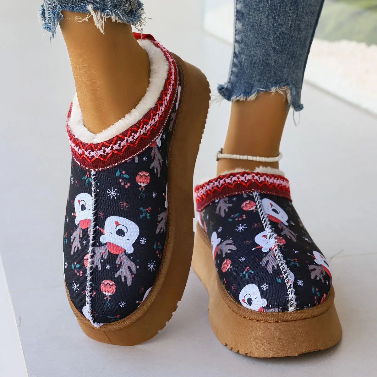 Women's winter ankle boots with festive cartoon Christmas print, plush lining, and durable EVA sole for comfortable, warm wear.
