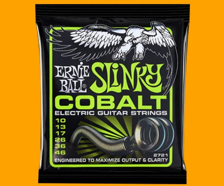 Coils of nickel-plated electric guitar strings and bass strings showing their metallic shine.