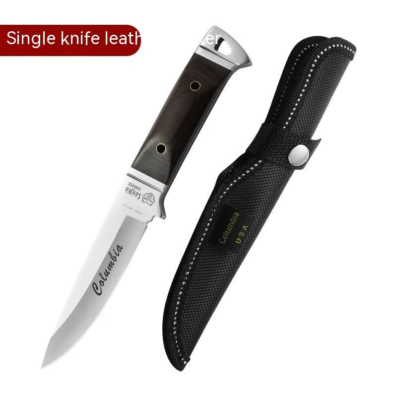 Camping fruit knife with stainless steel blade and brown leather sheath on a wooden surface